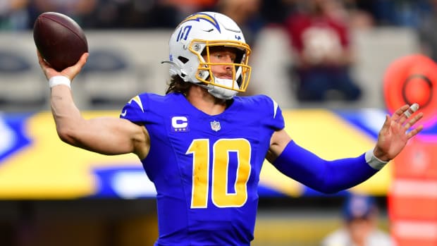Chargers quarterback Justin Herbert throws the ball during a game.